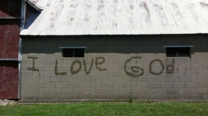 Lovina's three youngest children got creative and took a water hose to write these words on the side of their barn.